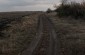 The road, flanked by an anti-tank ditch, along which columns of Jews were marched between the winter of 1941 and the summer of 1942. At least twenty deportees died from exhaustion or exposure to the cold along this route. ©Markel Redondo/Yahad - In Unum