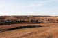 The former location of the collective farm stable where 800 Jewish men, women, and children were held before being shot in February 1942. Today, an empty field. ©Markel Redondo/Yahad - In Unum