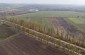 A drone view at the burial site of Jews in Luchynchyk. Both roads, the paved one and the dirt one, lead from Luchynchyk to Luchynets. ©Les Kasyanov/Yahad - In Unum