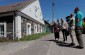 Jadvyga P., born in 1932, showing to the Yahad team the former Jewish bath house in Paslavys. During the war, it was situated on the ghetto’s territory. ©Markel Redondo/Yahad - In Unum