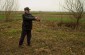 Stanisław P., born in 1936, shows the burial site of Jewish victims killed by Germans and their auxiliaries on the border of the villages of Dobrozy and Olchowiec in November 1942. ©Jethro Massey /Yahad - In Unum