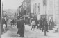 A Jewish street on a Sunday when the stores are closed: several generations fill the cobblestone pavement or sit on doorsteps. (Left) a child rolls a hoop. 1920s-30s © From the Archives of the YIVO Institute for Jewish Research